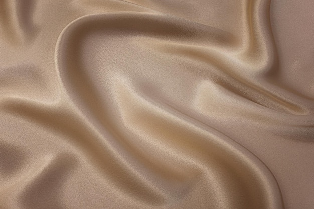 Closeup texture of natural beige fabric or cloth in brown color