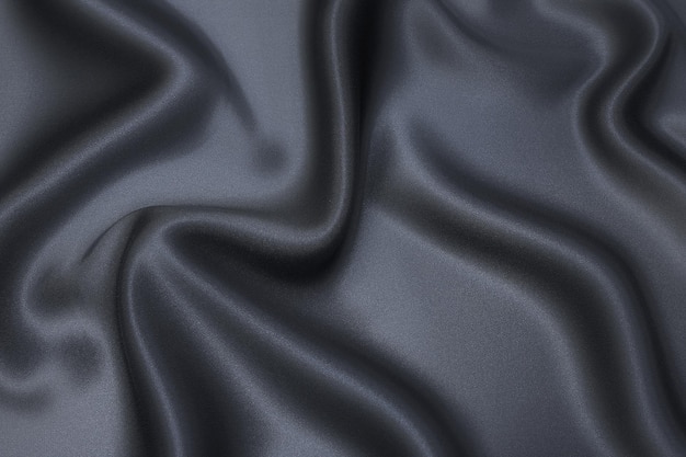 Closeup texture of natural gray fabric or cloth in black color Fabric texture of natural cotton or linen textile material Gray or black canvas background