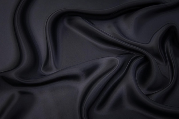 Closeup texture of natural gray fabric or cloth in black color Fabric texture of natural cotton or linen textile material Gray or black canvas background