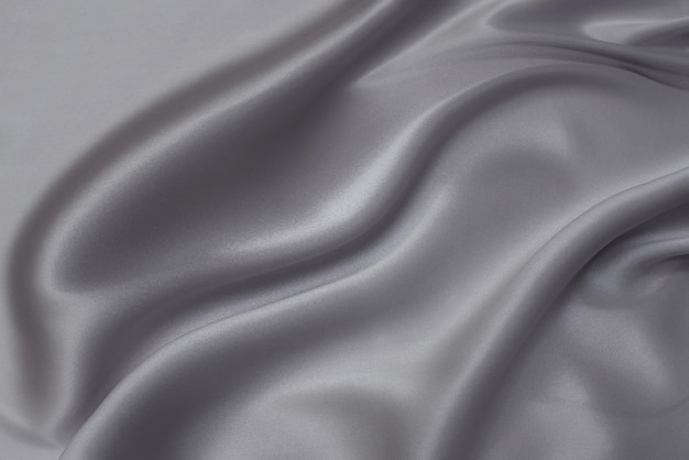 Closeup texture of natural gray fabric or cloth in black color Fabric texture of natural cotton or linen textile material Gray or black canvas background