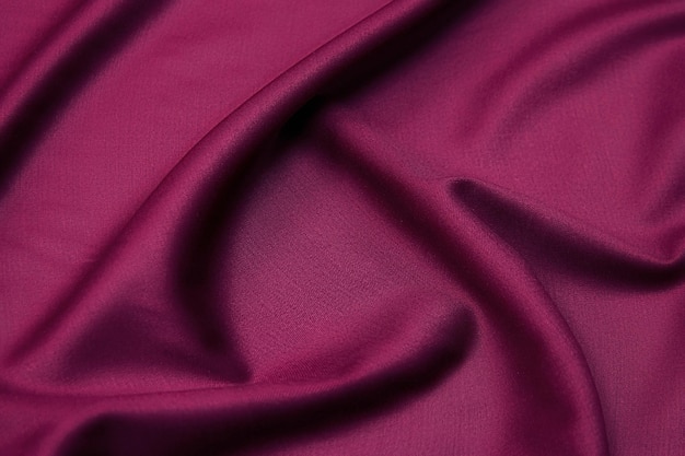 Closeup texture of natural red or pink fabric or cloth in same color Fabric texture of natural cotton silk or wool or linen textile material Red canvas background