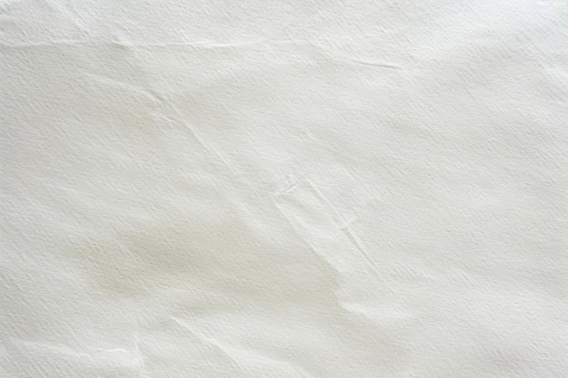 Closeup of textured white paper with subtle wrinkles and creases creating a natural organic pattern