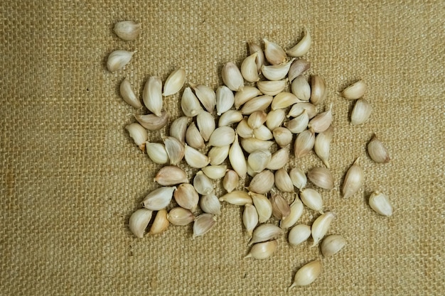 Closeup thailand garlic bulbs and garlic cloves on fresh garlic Background on market stand