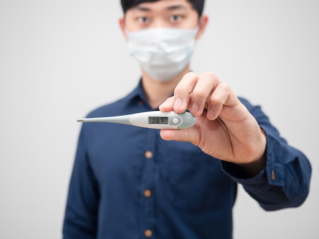 Closeup thermometer in man hand high temperature on white background