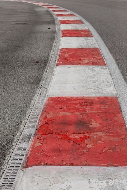 Closeup of tire tracks on a paved asphalt road race track texture and background abstract background black tire track Skid marks on an asphalt road