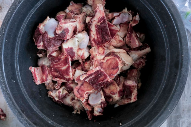 Closeup top view and texture of beef on Eid Al Adha Traditional Meat food inside a black bucket