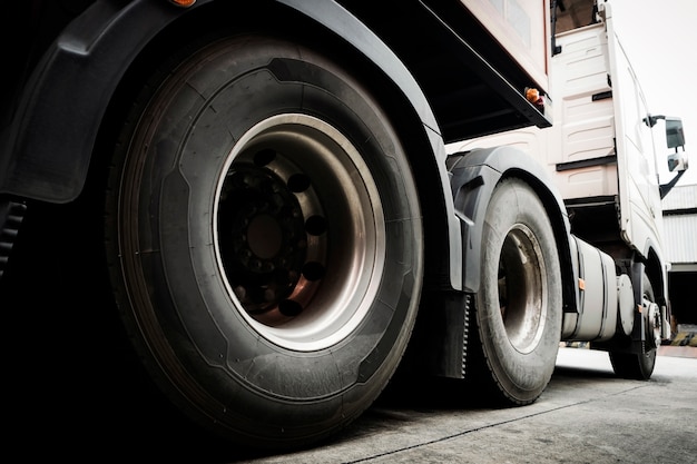 Closeup of truck wheels of semi truck trailer