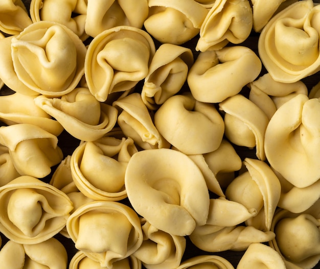 Closeup of uncooked italian pasta cappelletti or tortellini