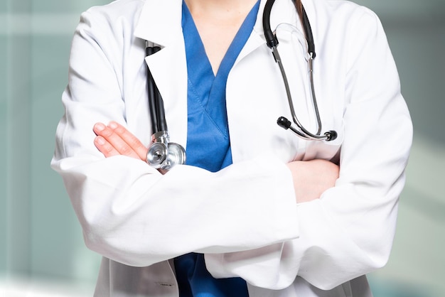 Closeup of an unrecognizable female doctor with folded arms