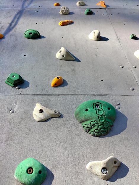 Closeup of various hooks on the wall for training in sport climbing