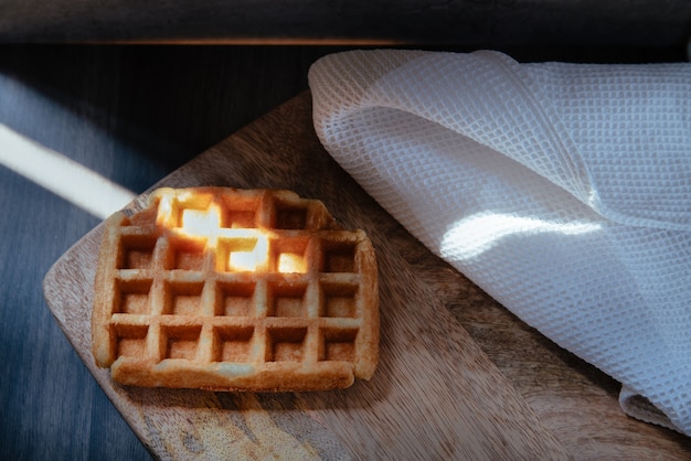 Closeup view of a artisan waffle a wood table