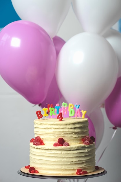 Closeup view of delicious birthday cake with number four on top