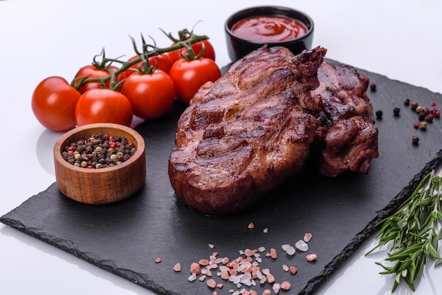 Closeup view of delicious grilled beef medallions served on table