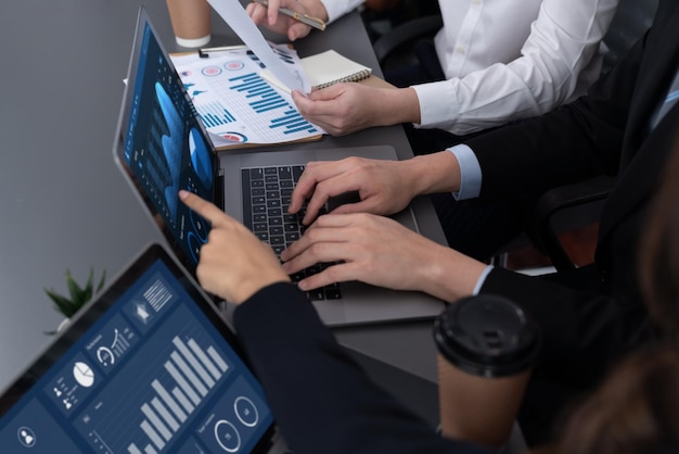 Closeup to view hand using laptop to analyze financial data in harmony office