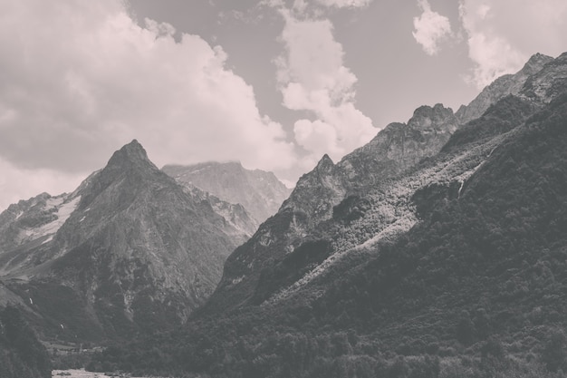 Closeup view mountains scenes in national park Dombai, Caucasus, Russia, Europe. Summer landscape, sunshine weather, dramatic blue sky and sunny day