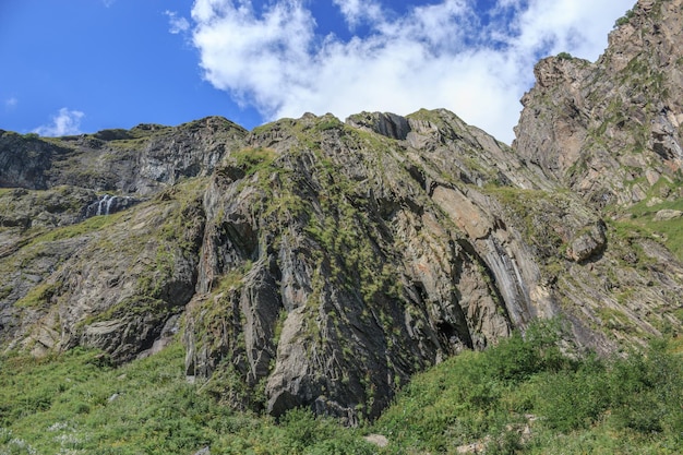 Closeup view mountains scenes in national park Dombai, Caucasus, Russia, Europe. Summer landscape, sunshine weather, dramatic blue sky and sunny day