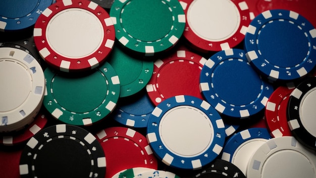 A closeup view of scattered colorful poker chips