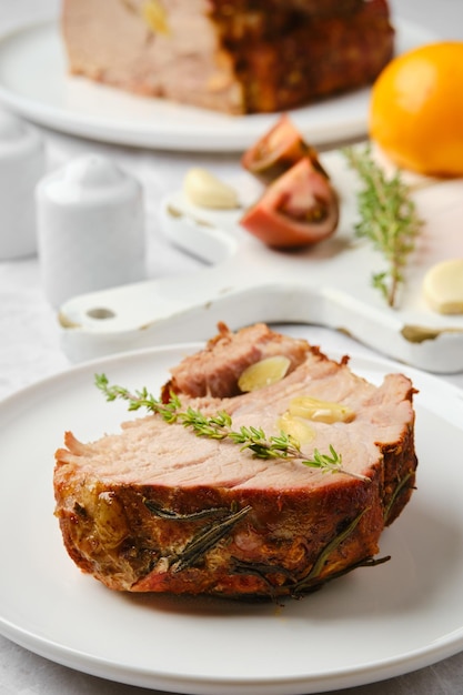 Closeup view of slice of pork neck baked in oven