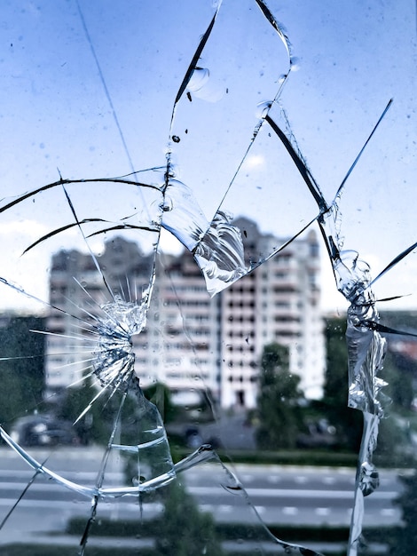 A closeup view through the broken glass of the surviving house opposite