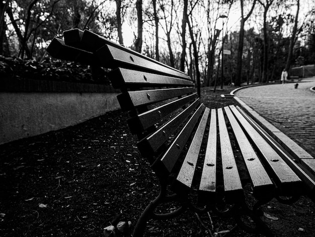 Closeup view of a wooden bench in a park