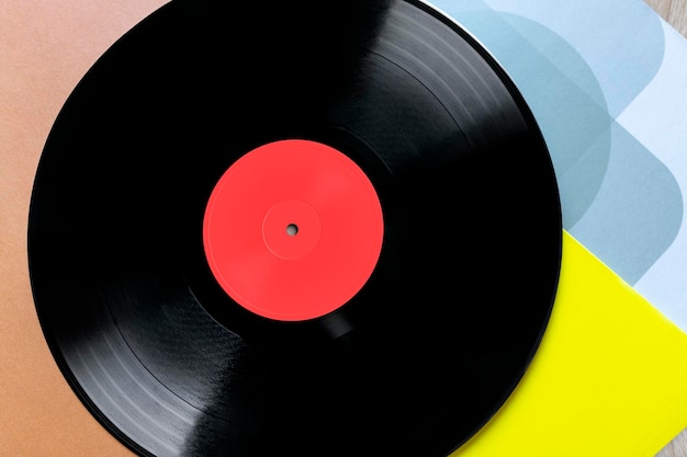 Closeup of vinyl record on colorful covers Top view