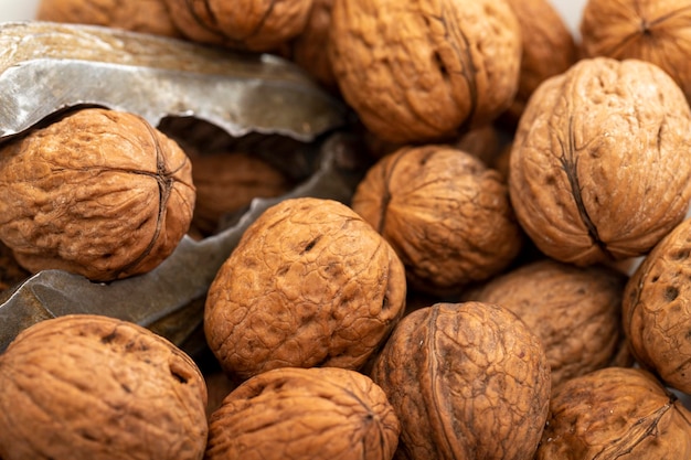 Closeup walnuts pile Walnut cracker