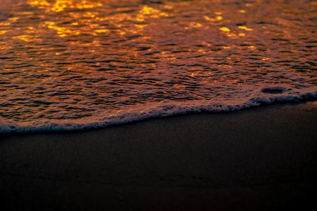 Closeup waves shot at sunset