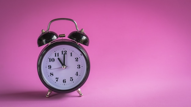 Closeup white clock on blue background