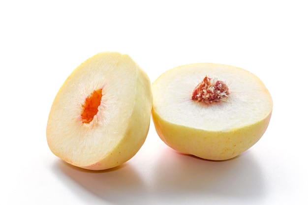 Closeup white peach cut half on white background