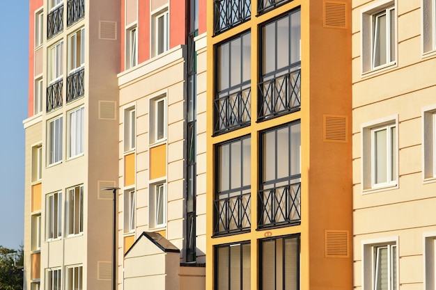 A closeup of the windows of a residential building with beautiful windows is a new multiapartment residential quarter of European houses