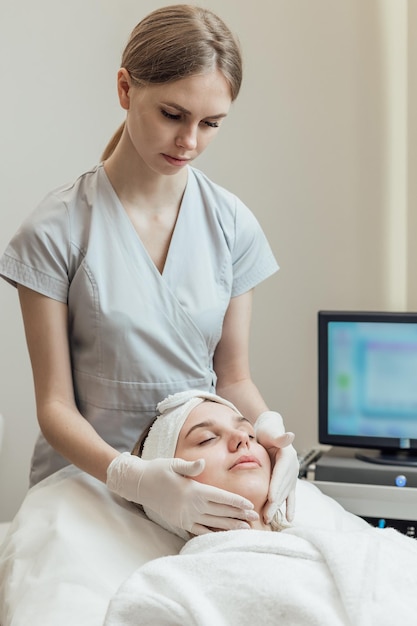 Closeup of woman getting peeling treatment at cosmetic beauty salon