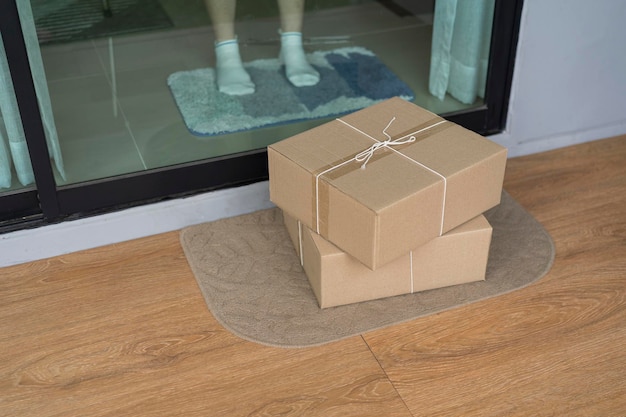 Closeup of a woman receiving parcels delivered to her doorstep