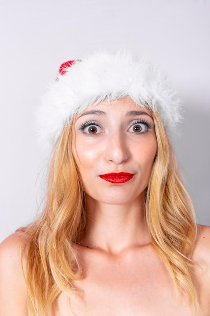 Closeup of woman39s face with christmas cap and cute expression