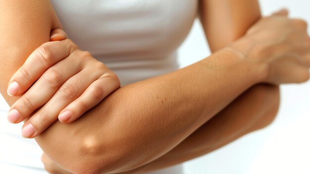 Photo closeup of womans arms crossed showing the detail of her elbow