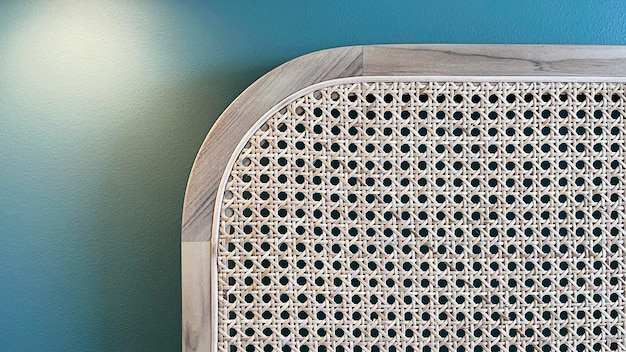 Closeup of wood chair with rattan, Beautiful  Teak wood texture surface , rattan pattern.