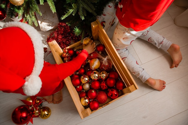 closeup of a wooden box with Christmas tree toys balls winter New years concept