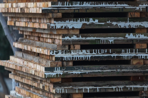 Closeup of wooden painted boards stacked tightly on top of each other