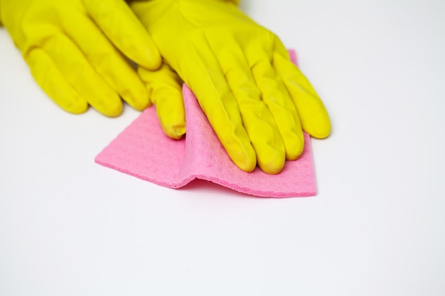 Closeup of worker hand wiping dust in office