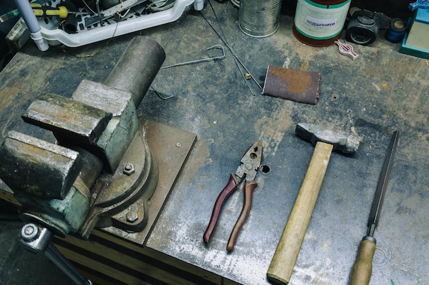 Closeup of working iron tools on metal background