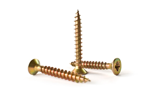 Closeup yellow zinc coated screw isolated on white. Self Drilling screws. Isolated fasteners