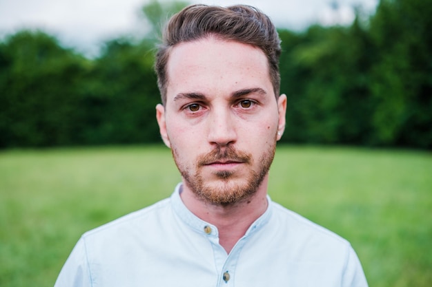 Closeup of a young man with a serious and grim face Concept Lifestyle pissed off seriousness