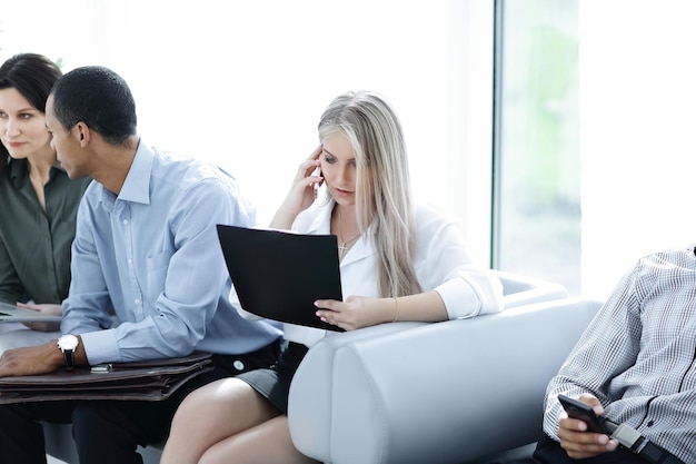 Closeupgroup of business people sitting in the lobby of the office