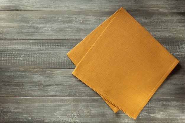 Cloth napkin on wooden table  