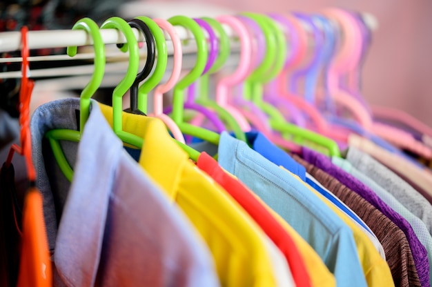 Clothes hanging on clothes hangers in the dressing room