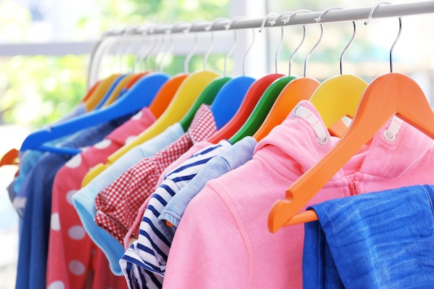 Clothes hanging on rack closeup