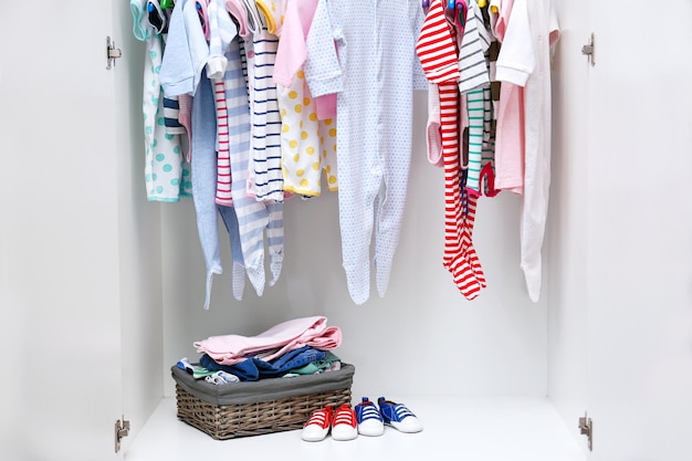 Clothes for kids in wardrobe