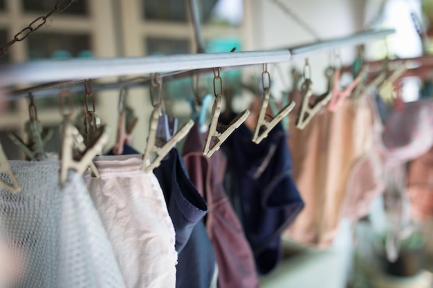 Clothes pegs or clothespins is hanging the underware on a cord