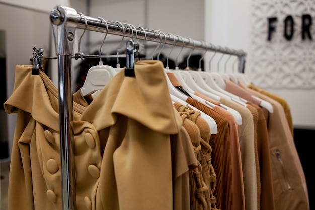 Clothes rack in shopping center Women clothes on racks in a boutique store