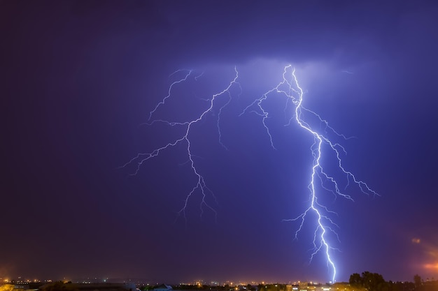 Cloud to ground lightning strike over Johannesburg at night time. This region of South Africa receives annual summer thunderstorms