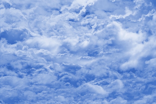 Clouds in the blue sky on a sunny day Sunny sky background